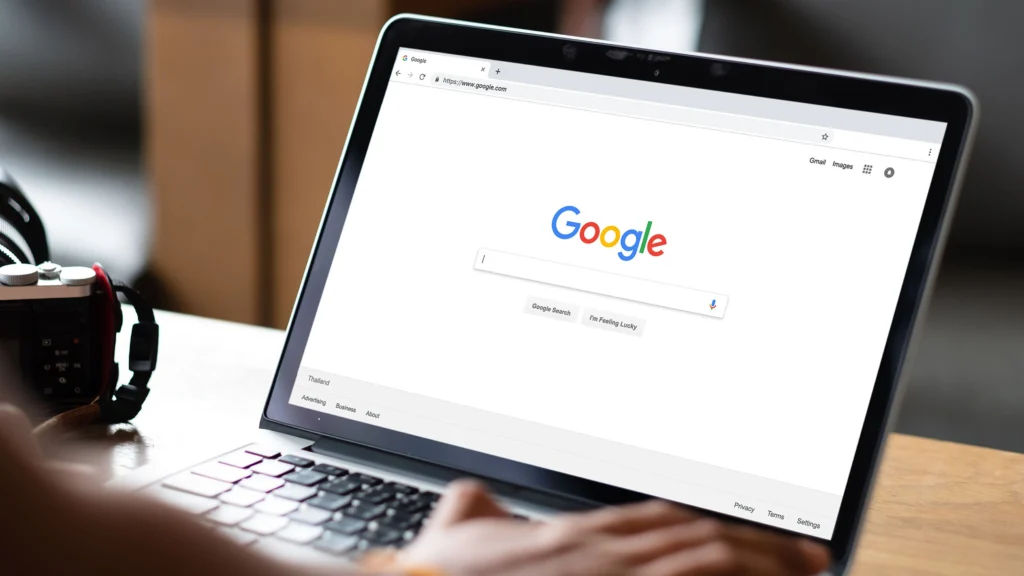 Man sitting at computer about to search Google