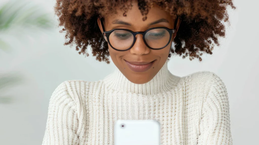 Woman checking her email on her iPhone